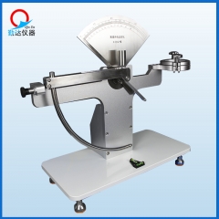 Anti-pendulum impact testing machine