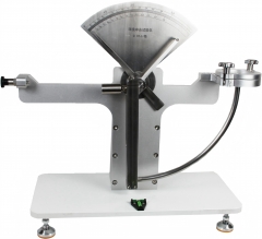 Anti-pendulum impact testing machine